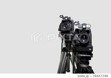 Camera and tripod against white background Camera and tripod against white background 76847286