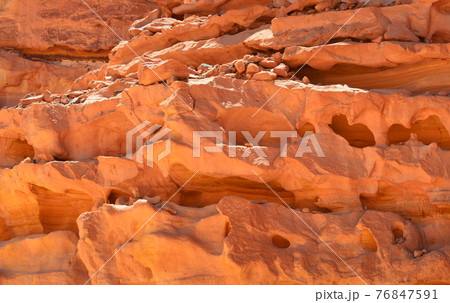 Rocks of multicolored sandstone in a colored canyon in the southeast of the Sinai Peninsula 76847591