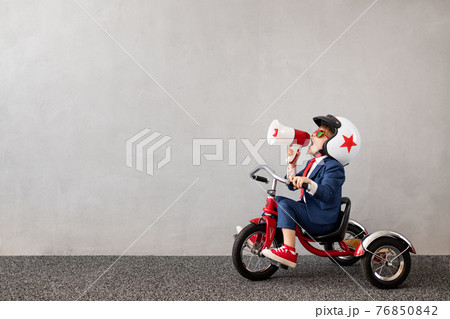 Happy child dreaming about travel 76850842
