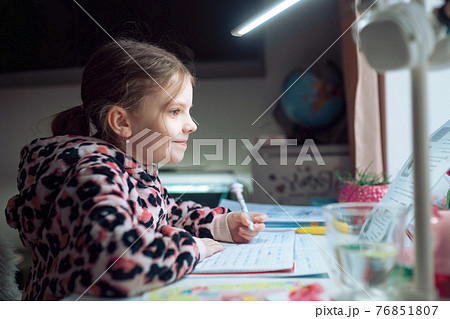 little girl at distance home schooling, study lessons on quarant 76851807