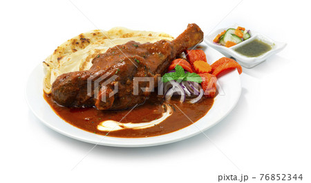 Braised Lamb Shank Masala Curry served Roti 76852344