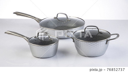 Set of empty stainless steel pots and pan isolated on white 76852737
