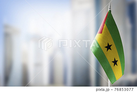 A small flag of Sao Tome and Principe on the background of a blurred background A small flag of Sao Tome and Principe on the background of a blurred background 76853077