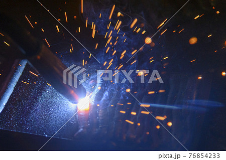Close-up scene of the electric welding process.  76854233