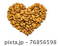 A heart made up of almonds. Subject on a white background. 76856598