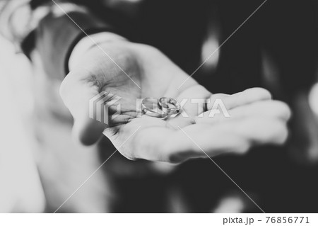 Newly wed couple's hands with wedding rings Newly wed couple's hands with wedding rings 76856771