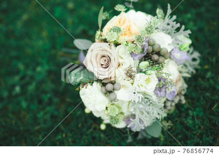 Wonderful luxury wedding bouquet of different flowers Wonderful luxury wedding bouquet of different flowers 76856774