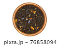Black tea Earl Grey in wooden bowl isolated 76858094