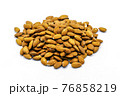 A group of shelled almonds on a white background. Perfect shot for vegan living, health and wellness. 76858219