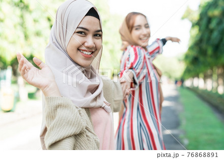 Two friends enjoying the summer sun Two friends enjoying the summer sun 76868891