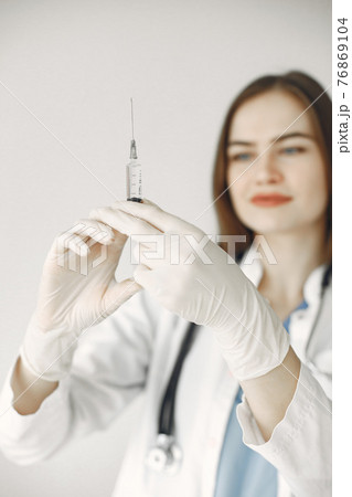 Doctor with vaccination against covid19 76869104