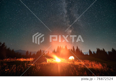 Night sky full of stars, Milky way in the mountains in summer 76872524