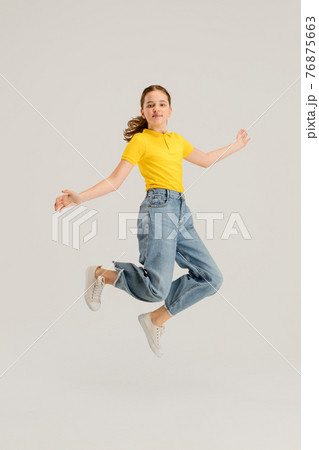 Caucasian girl isolated on white studio background. Copyspace. Childhood, education, emotions concept Caucasian girl isolated on white studio background. Copyspace. Childhood, education, emotions concept 76875663