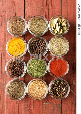 Various kinds of colourful seasonings in bowls. Collection of spices Various kinds of colourful seasonings in bowls. Collection of spices 76875852