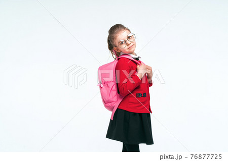 Adorable little girl in red school jacket, black dress, rounded Adorable little girl in red school jacket, black dress, rounded 76877725