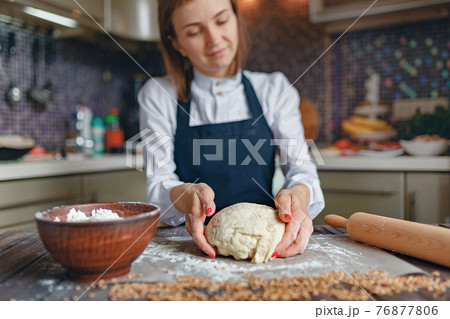 Woman cooking in apron 76877806