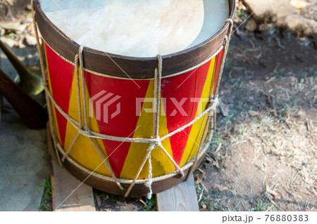 drum military red and yellow for knocking out a march close-up 76880383