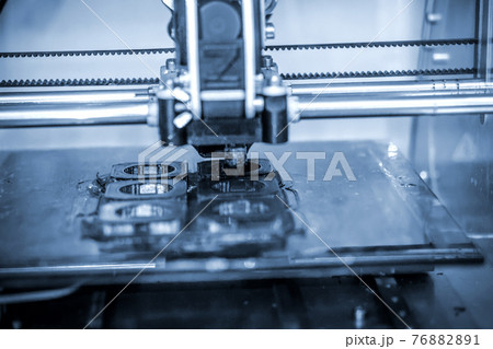 Modern 3D printer printing figure close-up. Automatic three dimensional 76882891