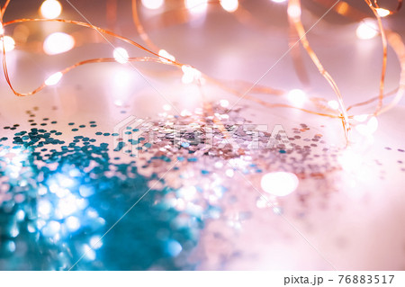 Pink and blue sparkles and lights on the pink background. Pink and blue sparkles and lights on the pink background. 76883517