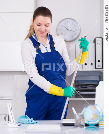 Young girl cleaning the room with mop Young girl cleaning the room with mop 76885885