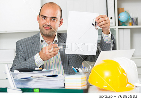Professional man working with documents 76885983