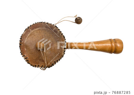 Damaru drum percussion instrument with a handle on a white background. Damaru drum percussion instrument with a handle on a white background. 76887285