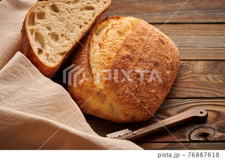 Homemade tartine bread on wooden table Homemade tartine bread on wooden table 76887618