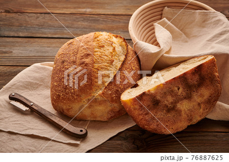 Homemade tartine bread on wooden table 76887625