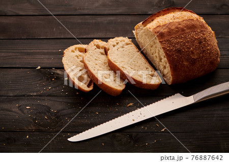 Homemade tartine bread on dark wooden table 76887642