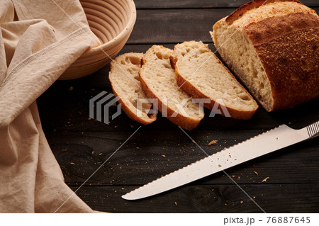 Homemade tartine bread on dark wooden table 76887645