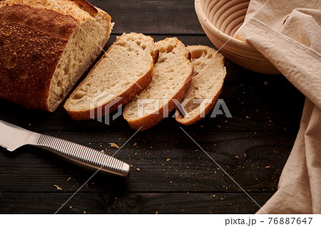 Homemade tartine bread on dark wooden table 76887647