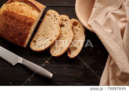 Homemade tartine bread on dark wooden table 76887649