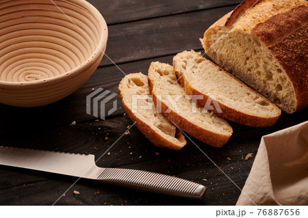 Homemade tartine bread on dark wooden table Homemade tartine bread on dark wooden table 76887656