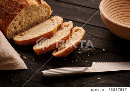 Homemade tartine bread on dark wooden table 76887657