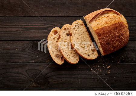 Homemade tartine bread on dark wooden table 76887667