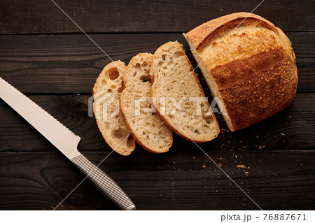 Homemade tartine bread on dark wooden table 76887671