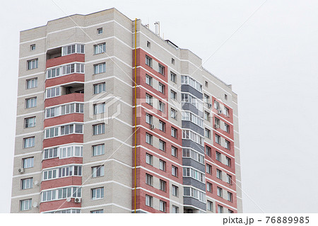 High-rise residential building with red brick balconies. High-rise residential building with red brick balconies. 76889985