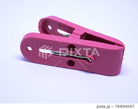 Red plastic clothespin isolated on white background  76894097