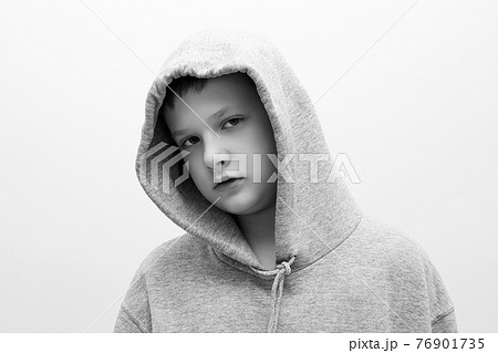 little boy in hood. teenager boy. Child 76901735
