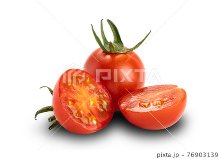 Side view a whole and two halves of ripe cherry tomatoes on white background. Side view a whole and two halves of ripe cherry tomatoes on white background. 76903139