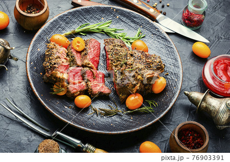 Succulent veal steak with kumquat,American barbecue 76903391