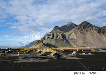 Mountains and volcanic lava sand in Stokksness, Iceland Mountains and volcanic lava sand in Stokksness, Iceland 76903630