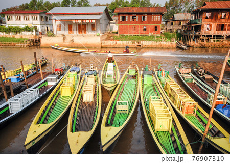 Wooden boats in Nyaungshwe, Myanmar 76907310