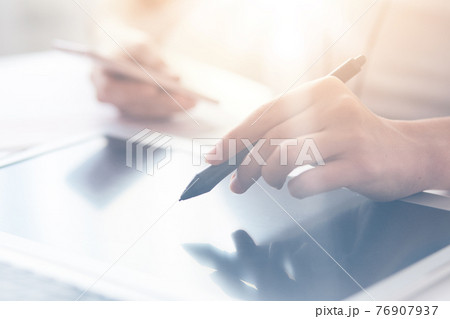 Close up shot of man hands holding and point with stylus on modern electronic digital frame with blank screen, programmer or designer working online at home, doing new project, using wireless Internet 76907937