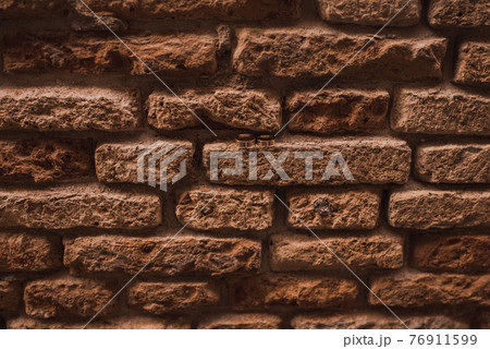 wedding rings in the wall between bricks wedding rings in the wall between bricks 76911599