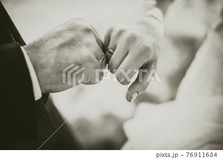 man and woman holding hands. wedding rings bride and groom man and woman holding hands. wedding rings bride and groom 76911684