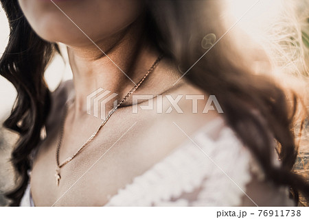 bride in a wedding dress on a background of sunbeams bride in a wedding dress on a background of sunbeams 76911738