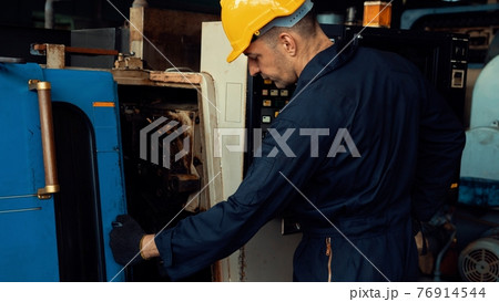 Skillful factory engineer or worker do machine job in manufacturing workshop Skillful factory engineer or worker do machine job in manufacturing workshop 76914544