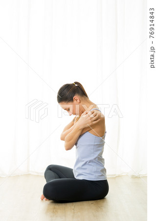 Portrait of gorgeous active sporty young woman practicing breathing exercises in yoga studio. Healthy active lifestyle, working out indoors in gym Portrait of gorgeous active sporty young woman practicing breathing exercises in yoga studio. Healthy active lifestyle, working out indoors in gym 76914843