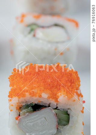 Salmon sushi rolls with red caviar and seafoods Salmon sushi rolls with red caviar and seafoods 76916063